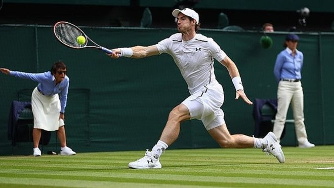 Man playing tennis at Wimbledon